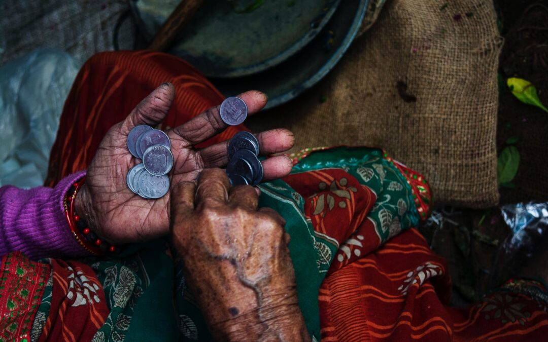 person holding coins