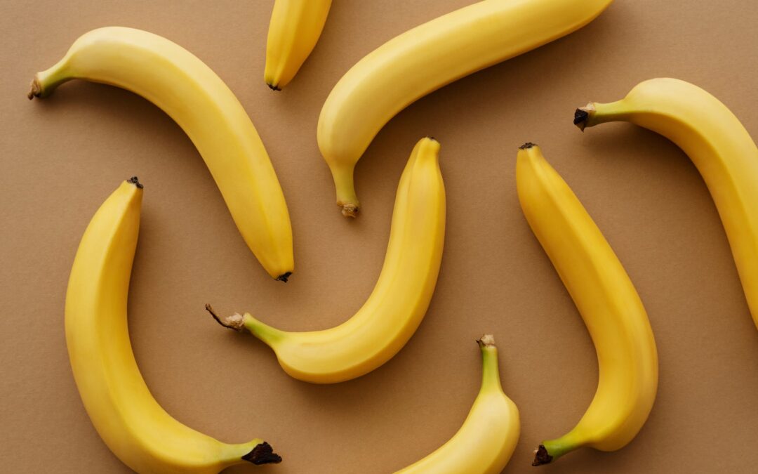 yellow banana fruits on brown surface