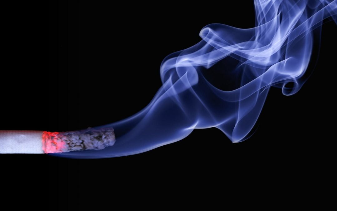 close up photo of lighted cigarette stick