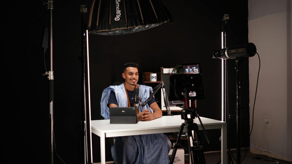 Current image: man recording video in professional studio setup