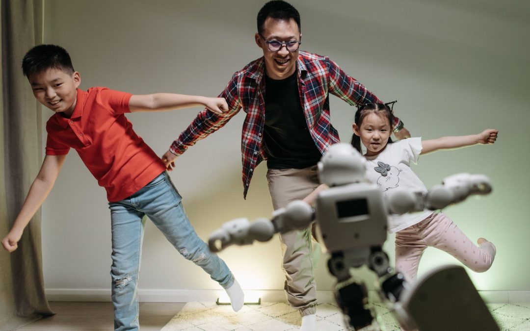 a happy family dancing with the robot