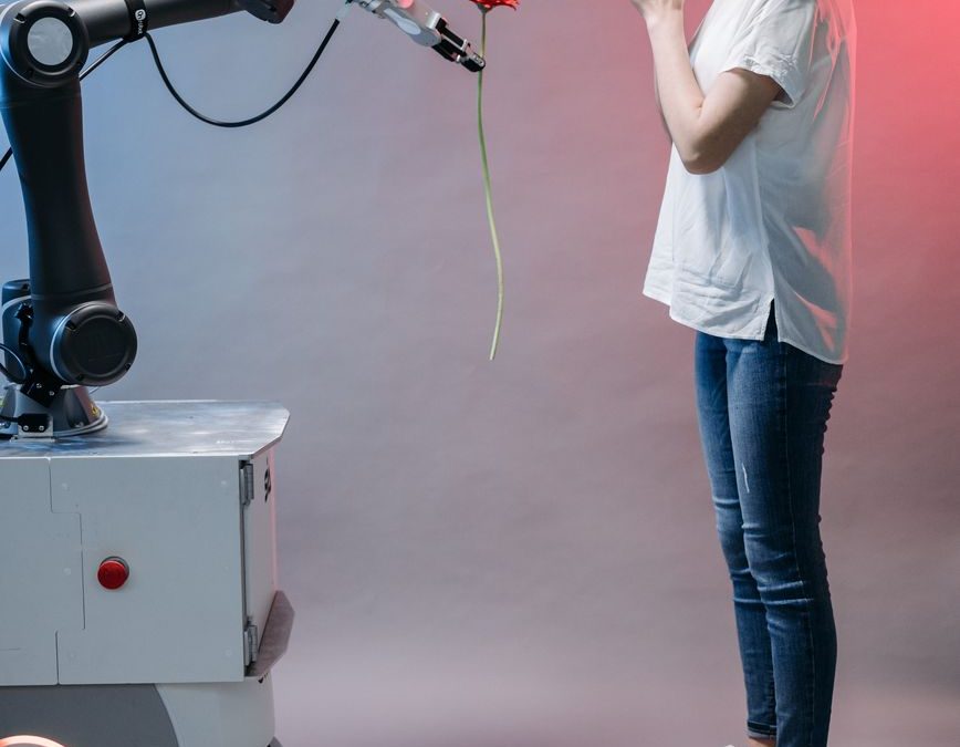 a robot holding a flower