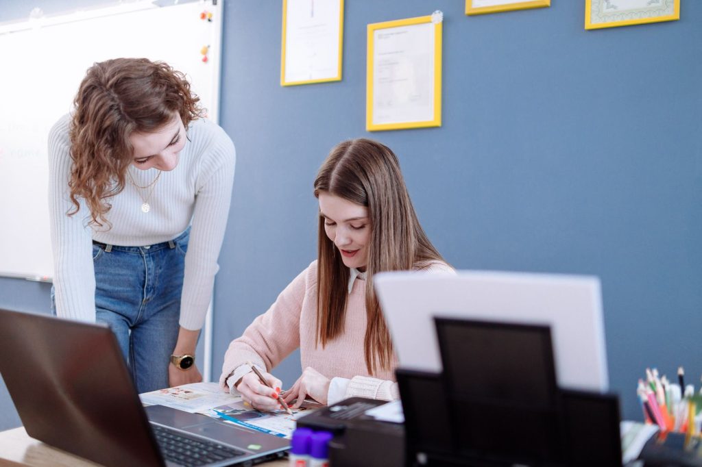 Current image: a teacher tutoring her student