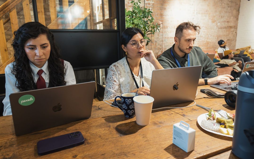 team focused on coursework in modern workspace