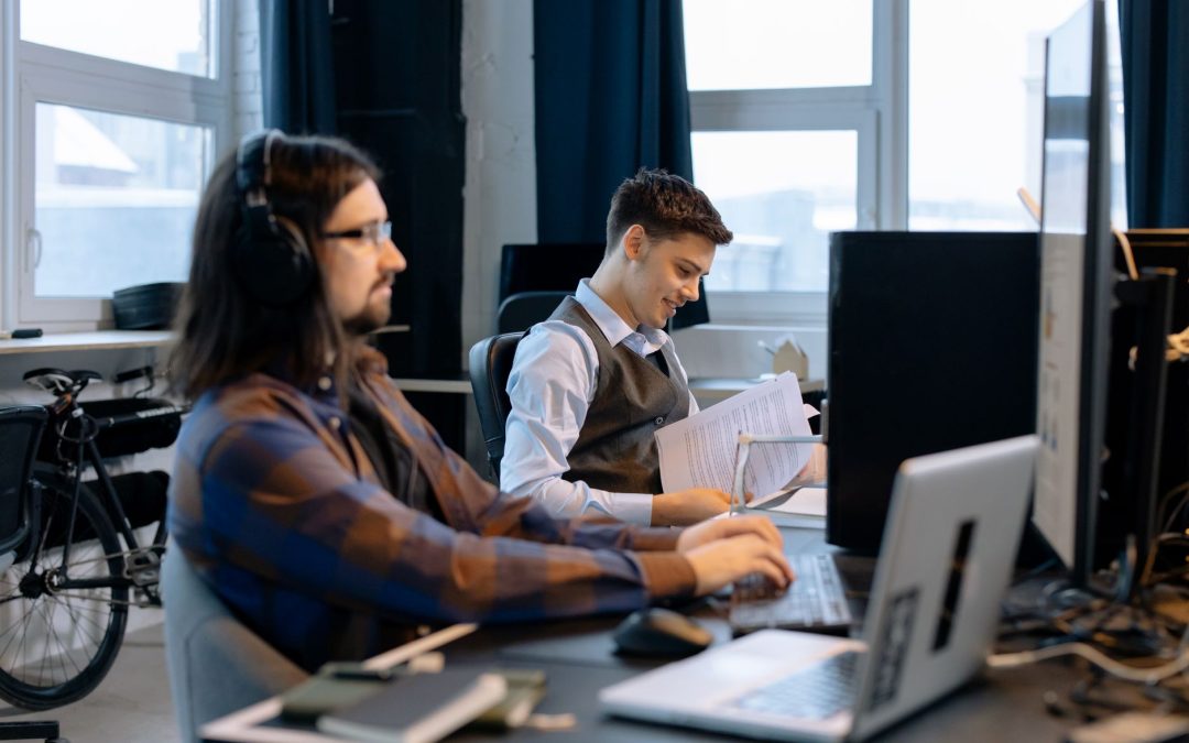 men sitting at the desk
